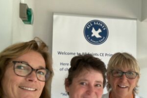 Three Female Volunteers Smile After A Volunteering Session