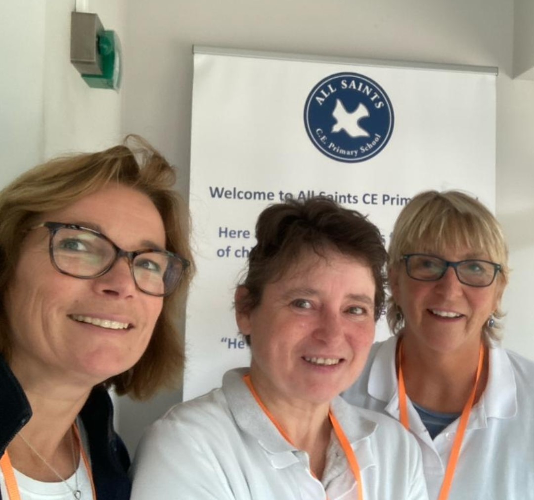 Three Female Volunteers Smile After A Volunteering Session